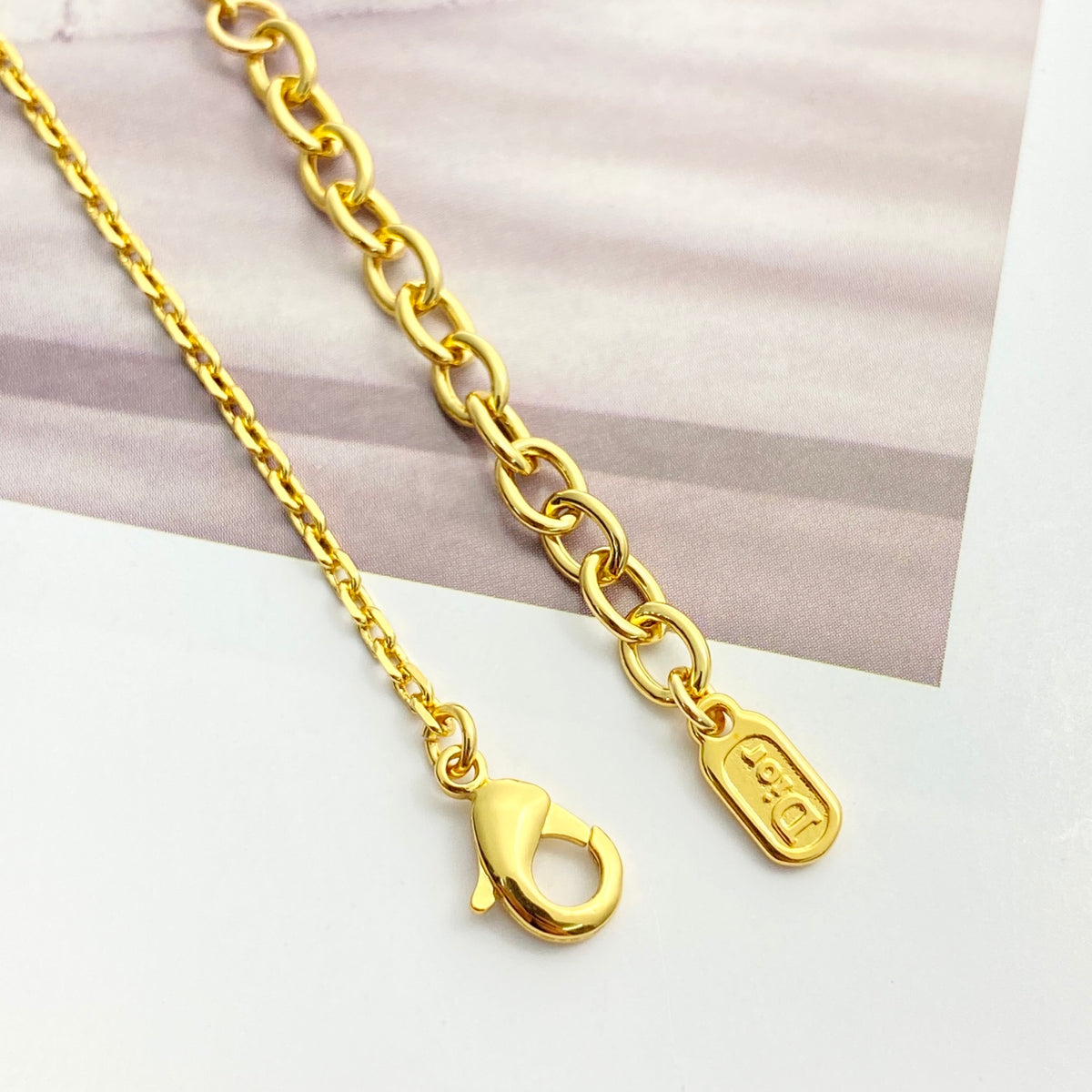 Graphic Letter Motif Statement Bracelet in Gold-Tone close-up detail