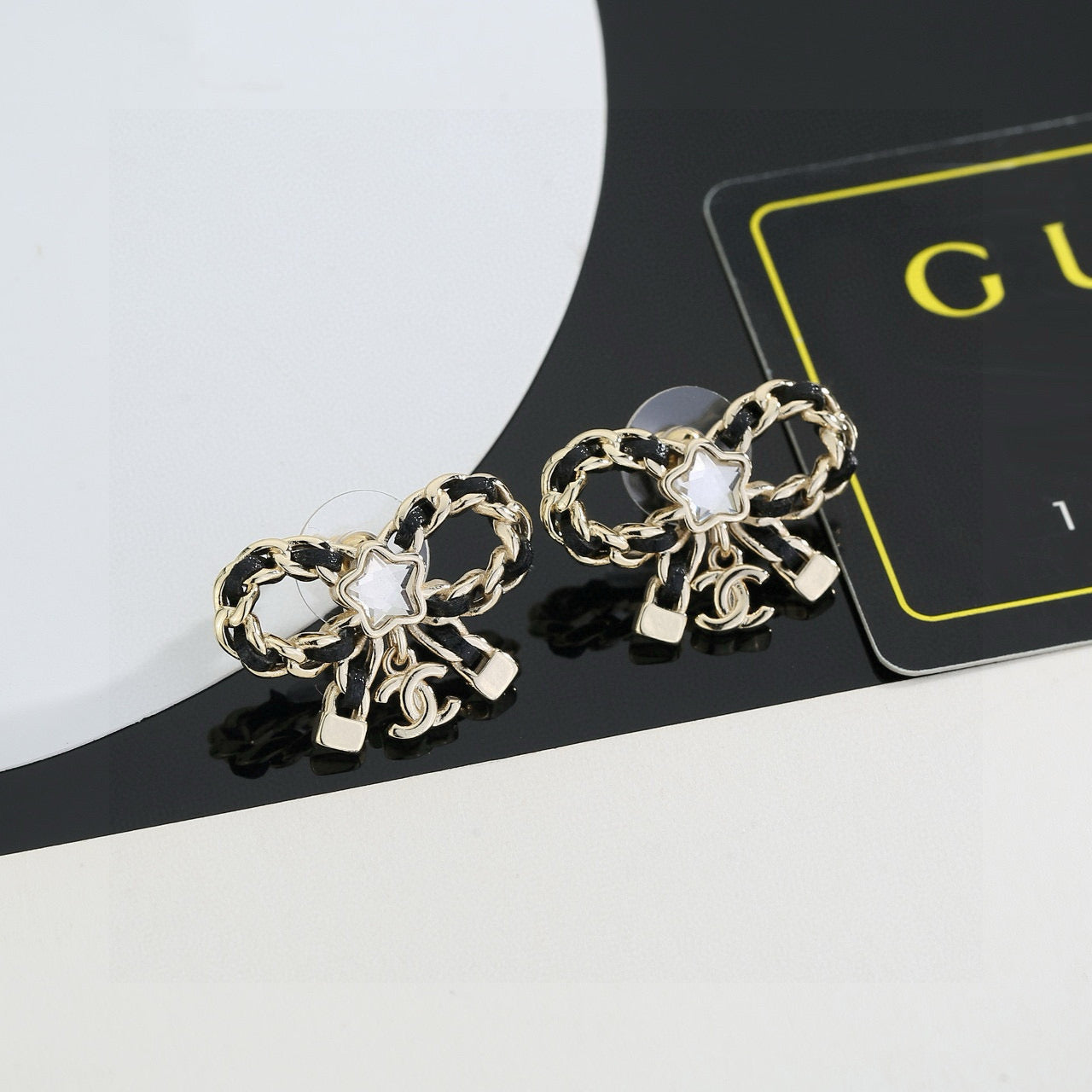 Double-C Emblem Stud Earrings in Polished Metal-Tone – Design 285 front product view