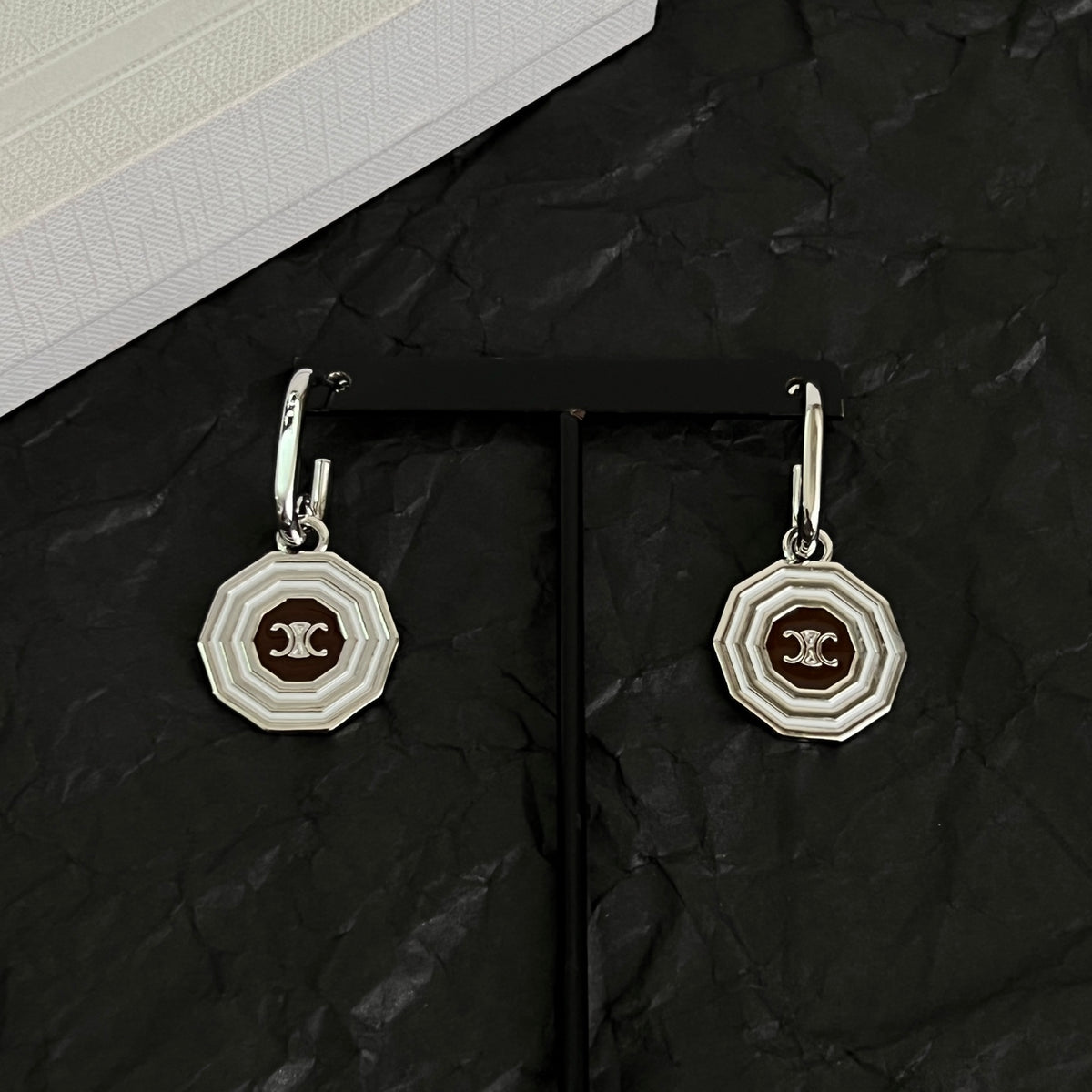 Signature Emblem Stud Earrings in Polished Metal-Tone – Design 02 close-up view