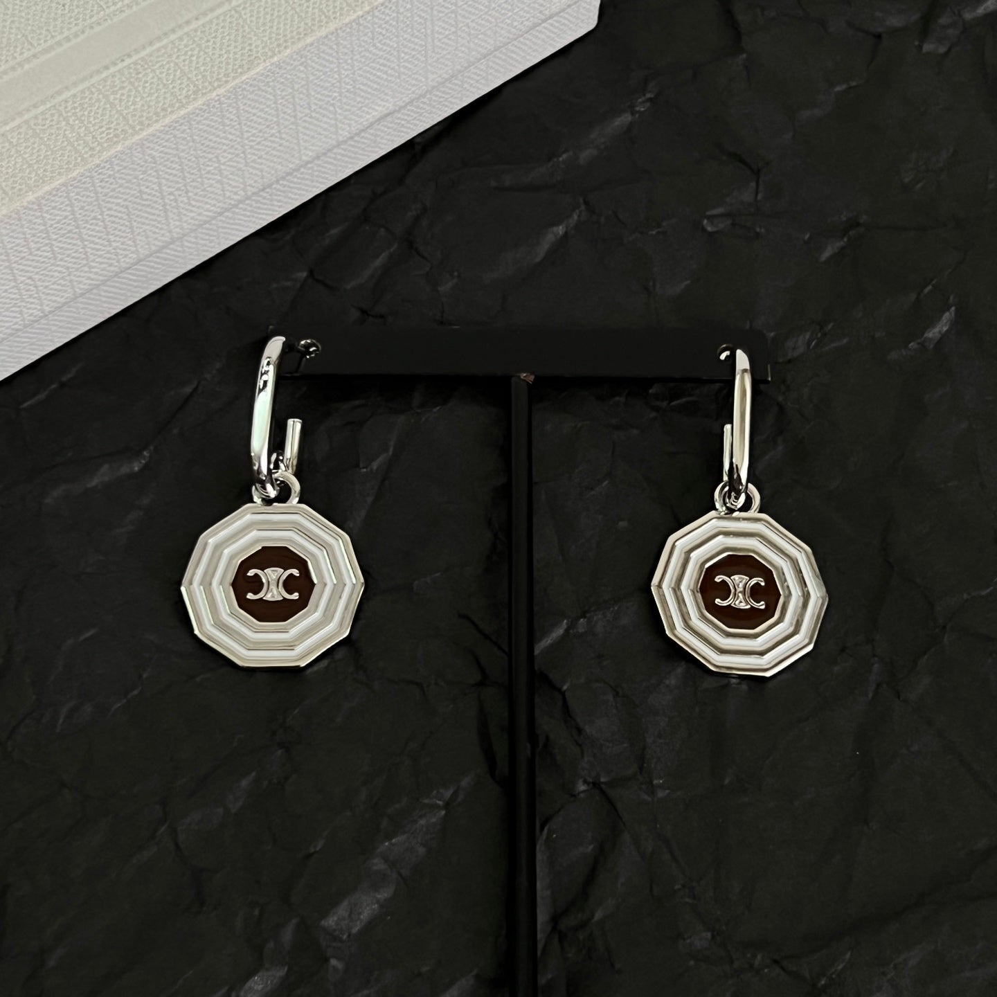 Signature Emblem Stud Earrings in Polished Metal-Tone – Design 02 close-up view