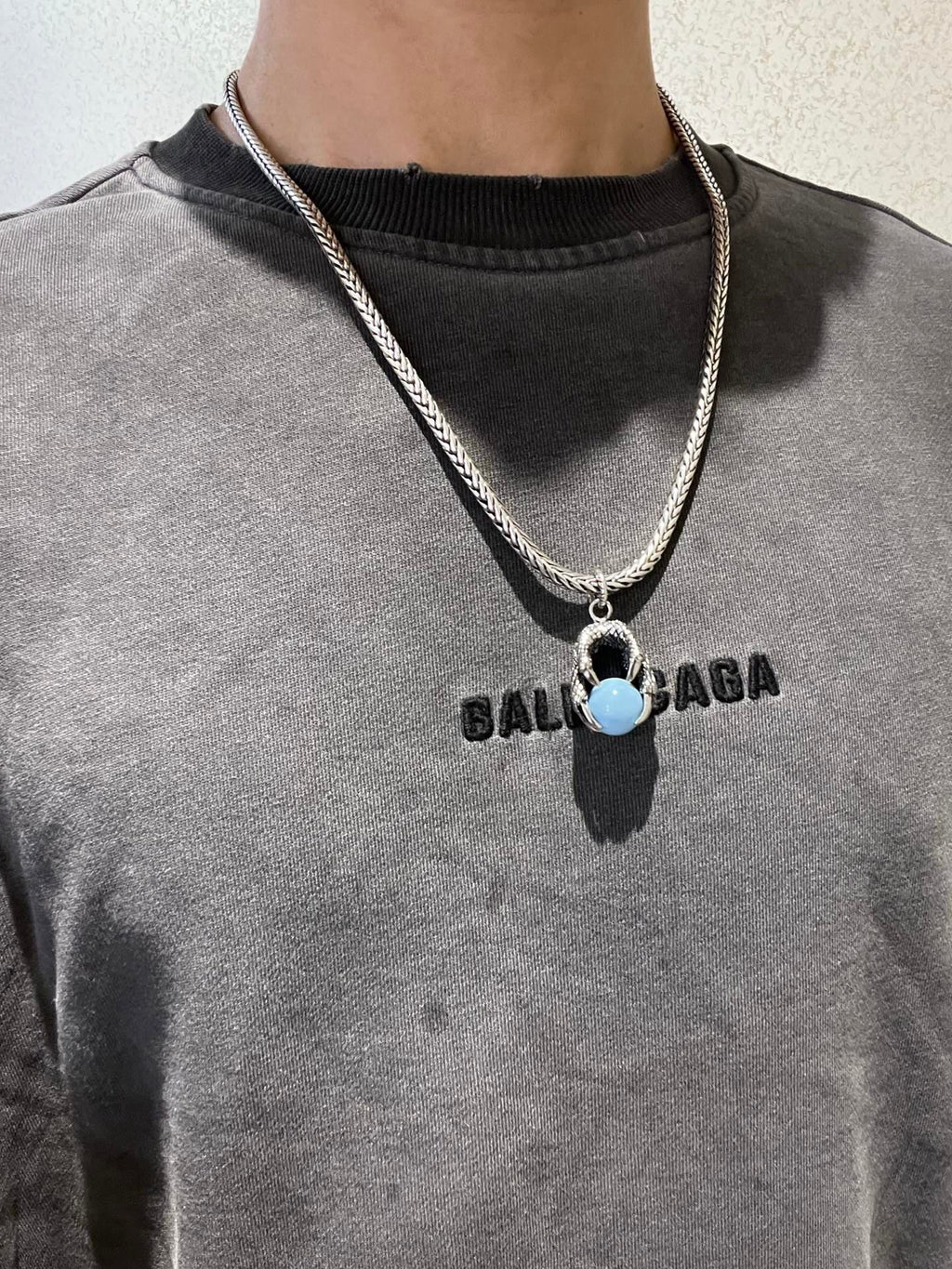 Double-G Emblem Pendant Necklace in Polished Metal-Tone – Turquoise Detail front product view