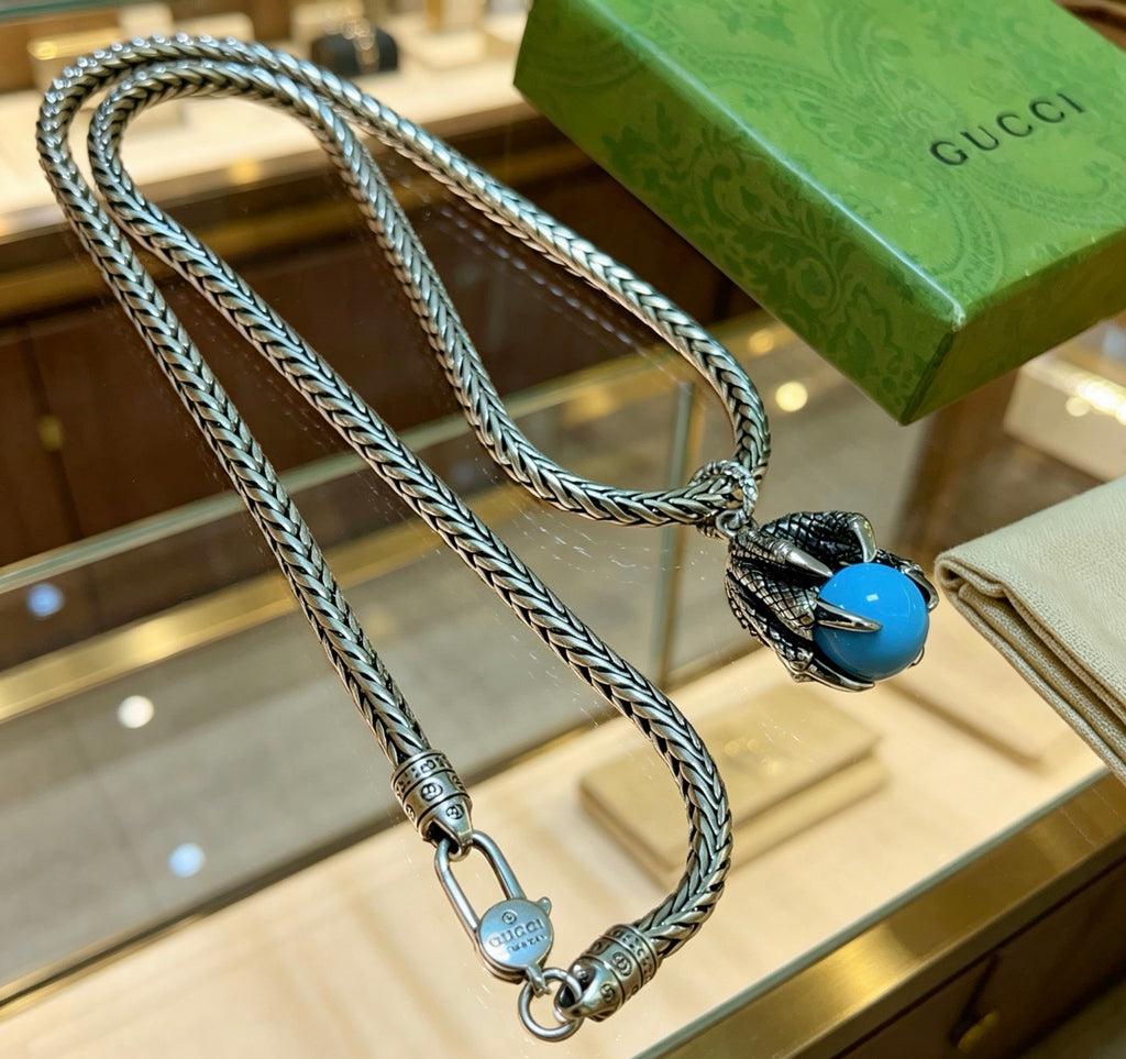 Double-G Emblem Pendant Necklace in Polished Metal-Tone – Turquoise Detail detail view