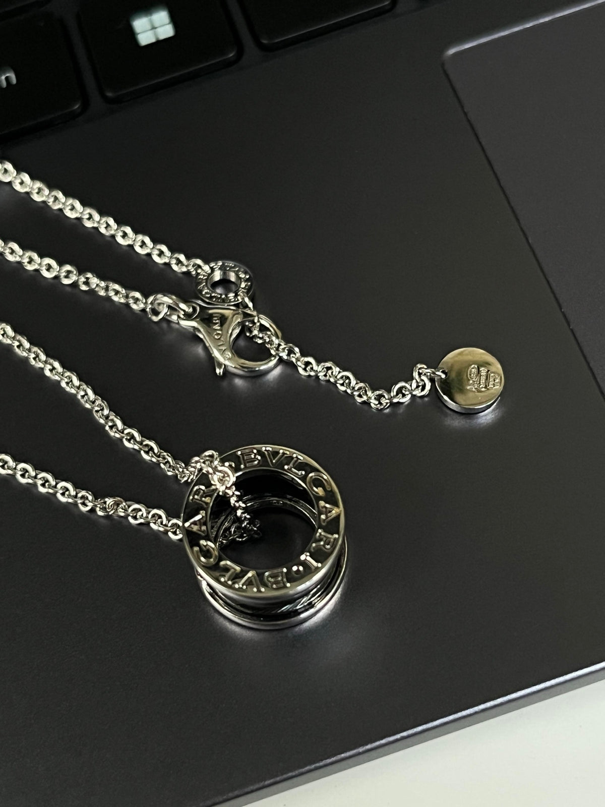 Geometric Emblem Pendant Necklace in Silver-Tone – Silver Detail close-up detail