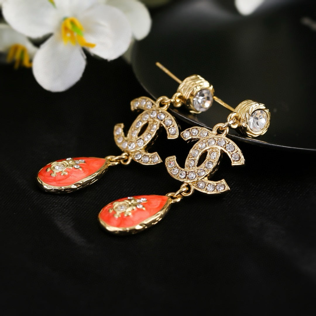 Double-C Emblem Stud Earrings in Gold-Tone – Design 024 close-up detail