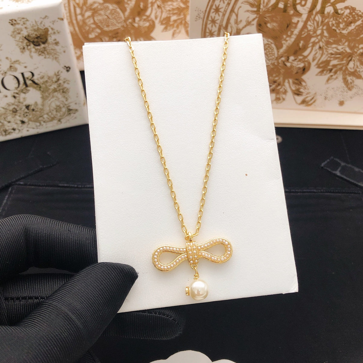 Bow & Butterfly Motif Pendant Necklace in Polished Metal-Tone – Design 005 styled view