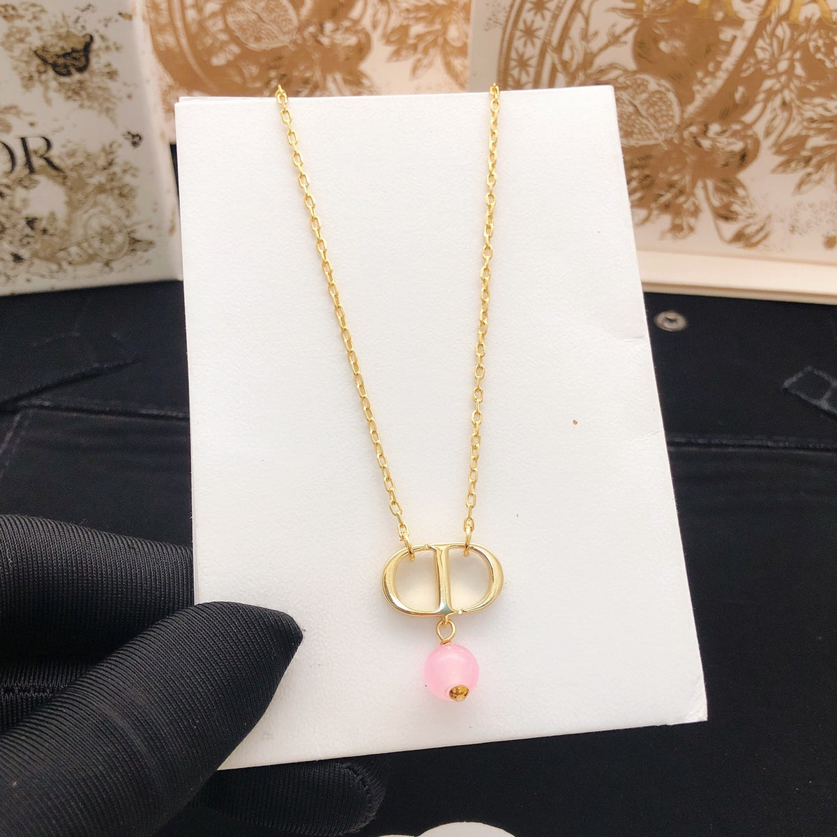 Pearl-Style Motif Pendant Necklace in Polished Metal-Tone with Pearl-Style Detail – Design 017 styled view