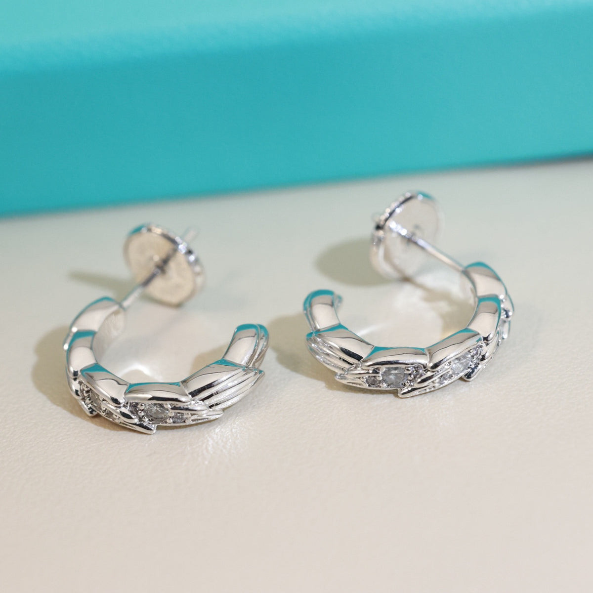 Signature Motif Stud Earrings in Polished Metal-Tone – Design 02 main product view