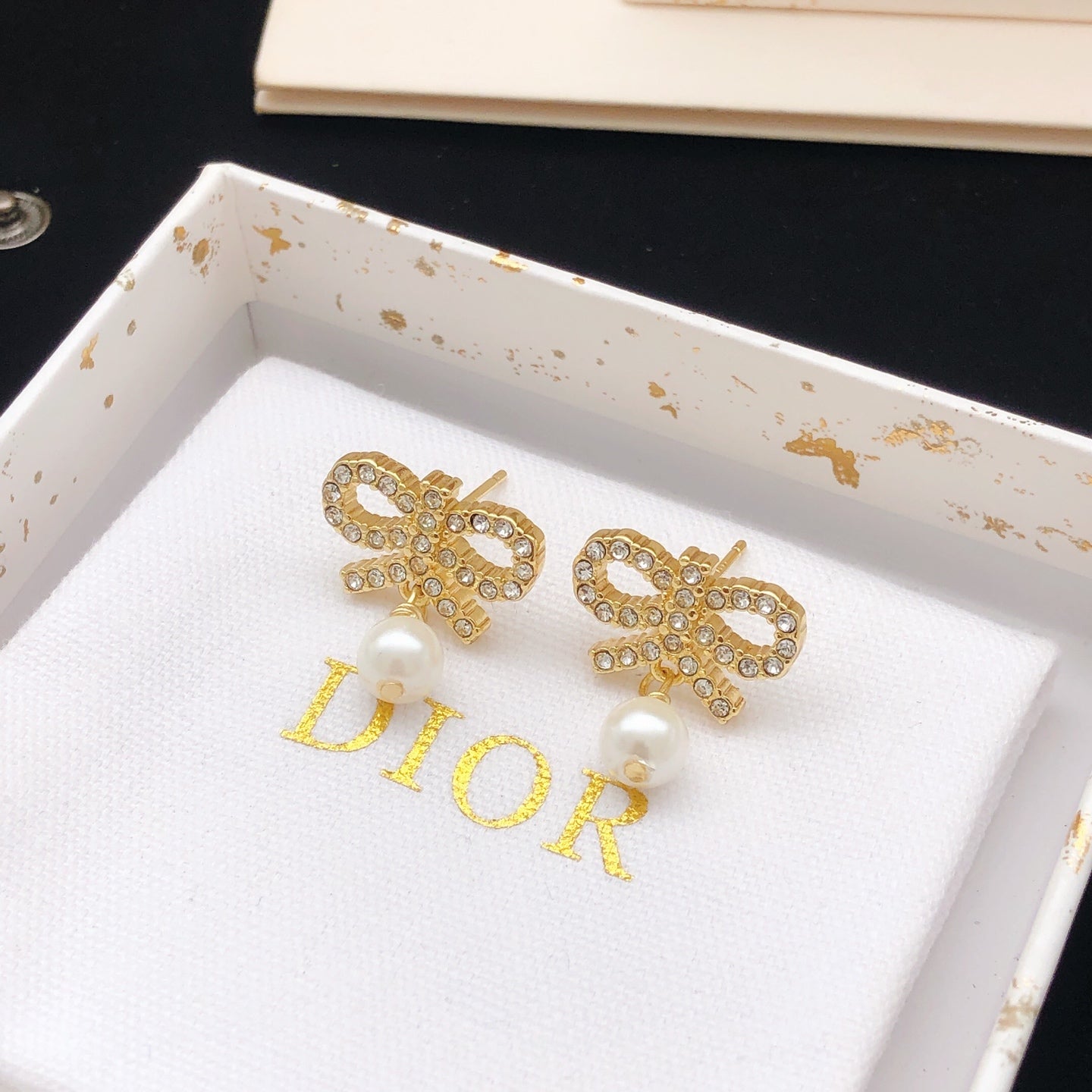Bow & Butterfly Motif Stud Earrings in Polished Metal-Tone with Pearl-Style Detail side detail