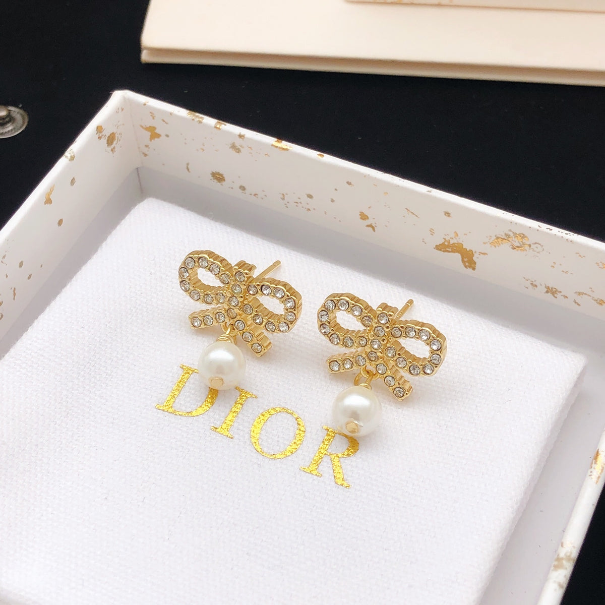 Bow & Butterfly Motif Stud Earrings in Polished Metal-Tone with Pearl-Style Detail side detail