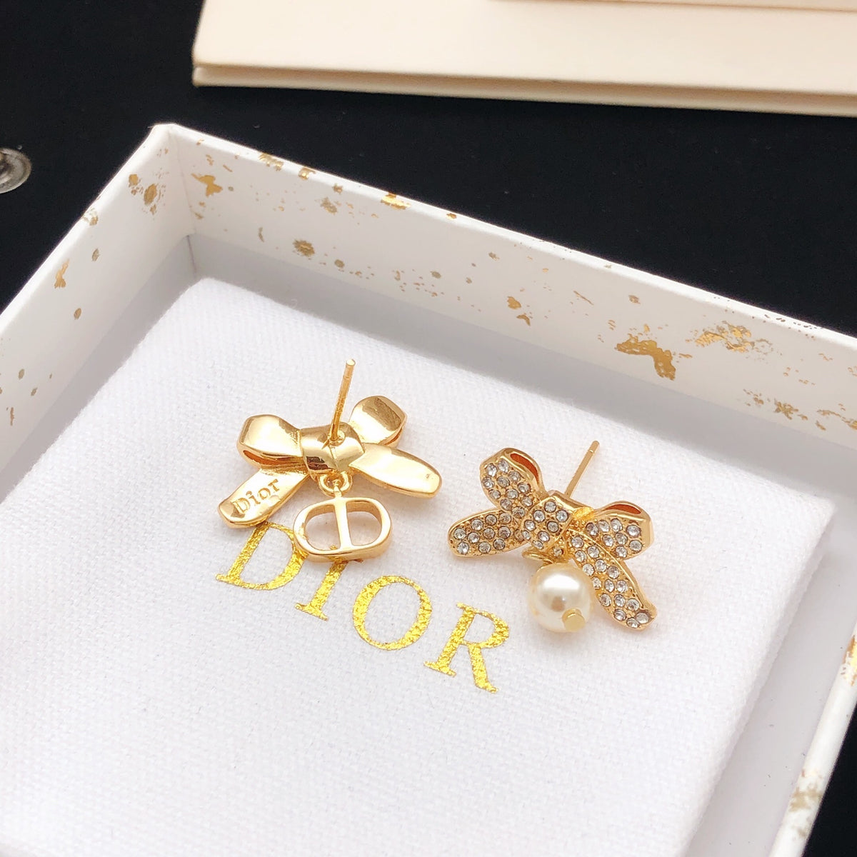 Bow & Butterfly Motif Stud Earrings in Rose-Gold-Tone styled view