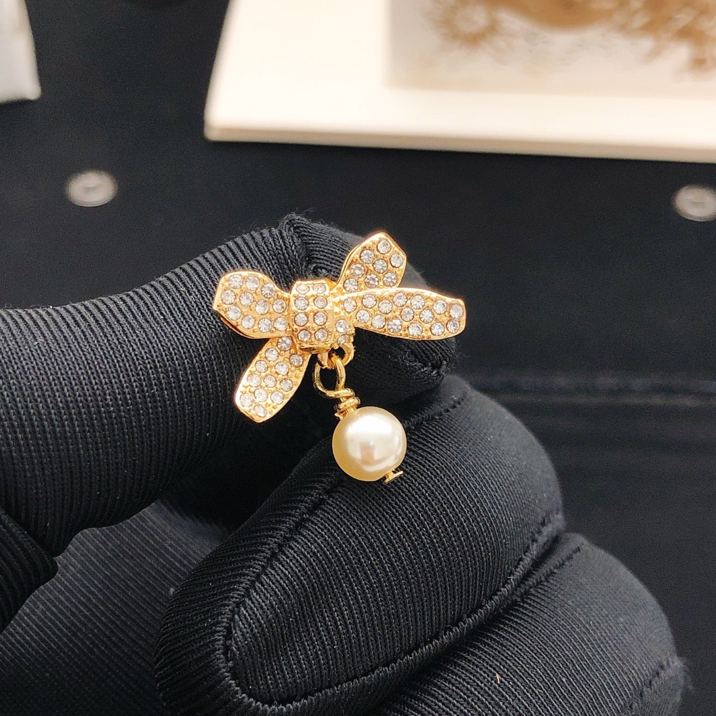 Bow & Butterfly Motif Stud Earrings in Rose-Gold-Tone detail view