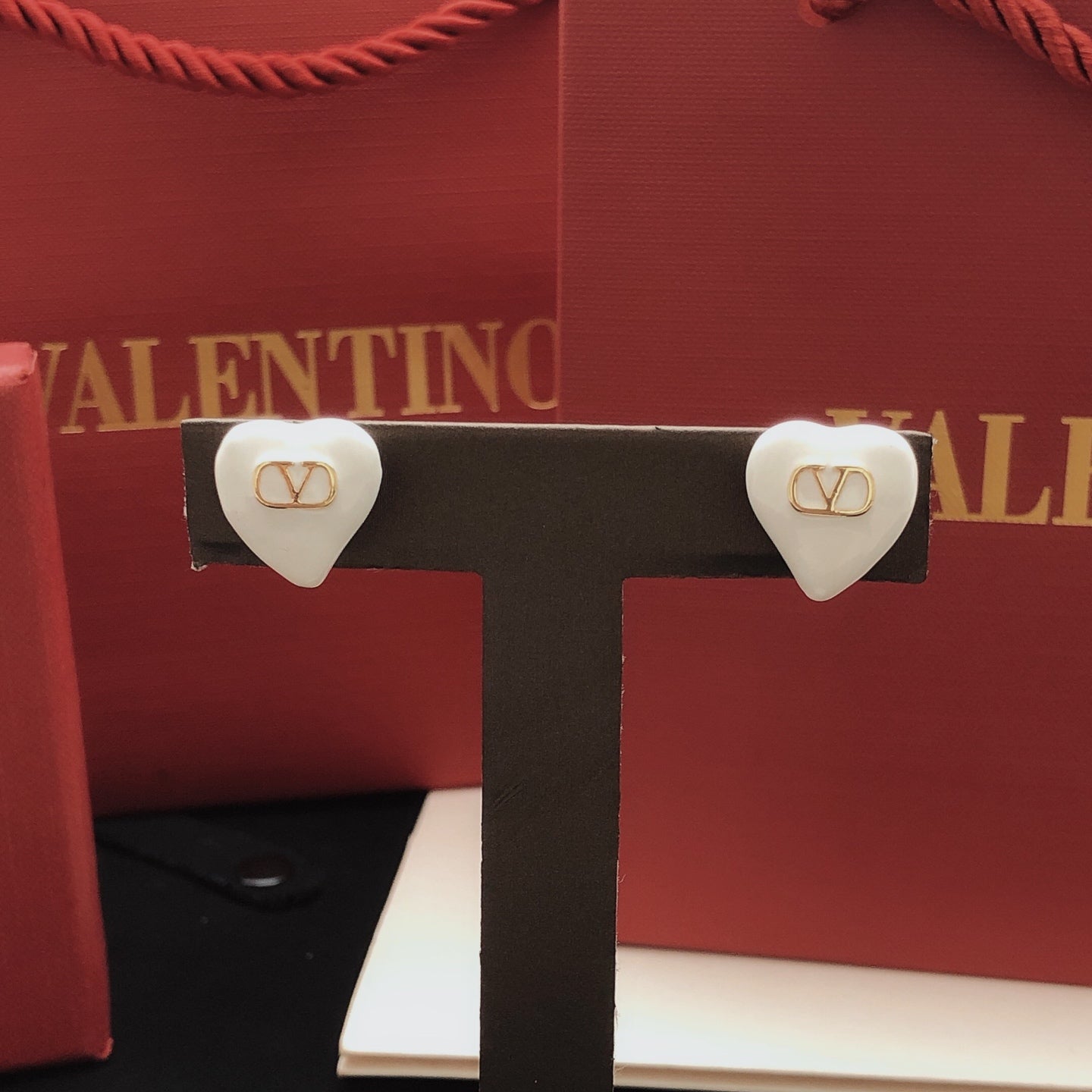 Heart Stud Earrings in Gold-Tone – White close-up view