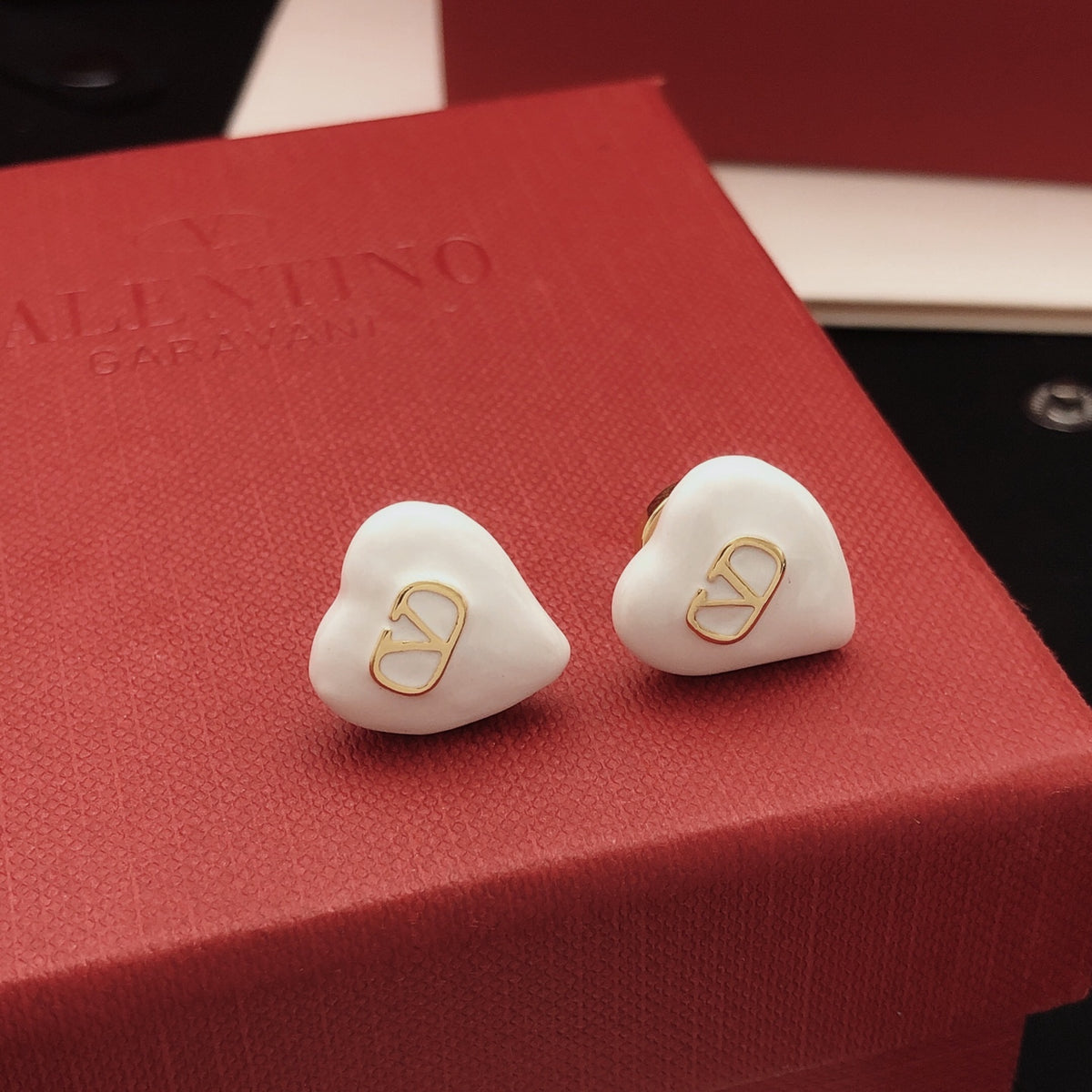 Heart Stud Earrings in Gold-Tone – White styled detail