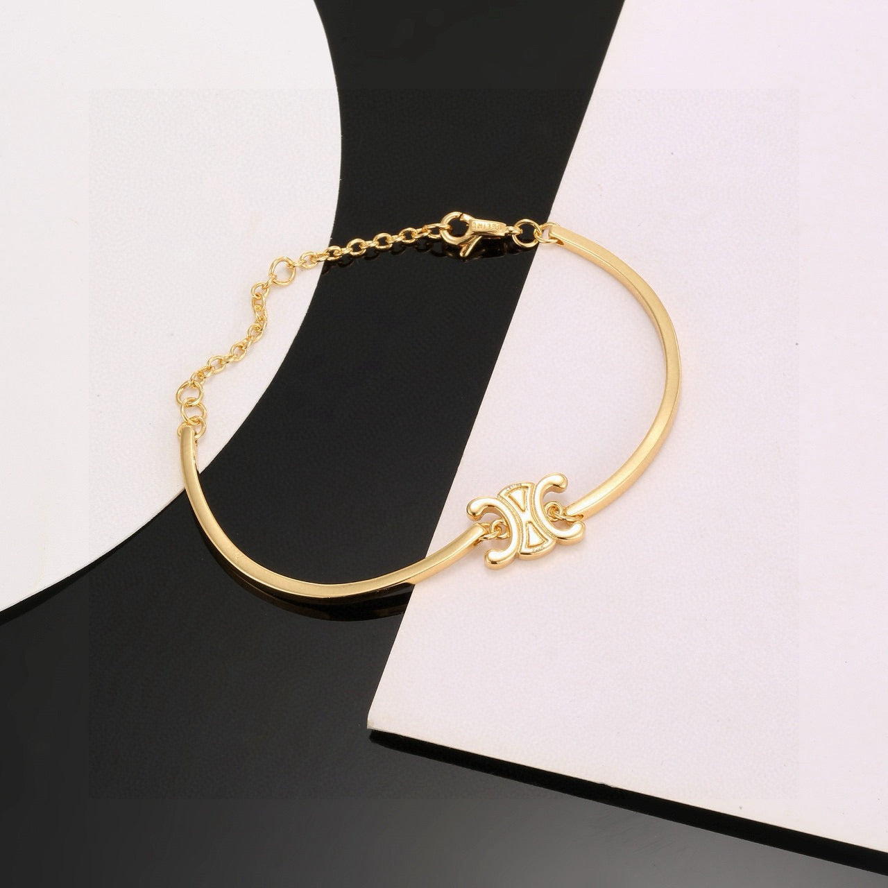 Triomphe-Inspired Emblem Cuff Bracelet in Gold-Tone close-up view