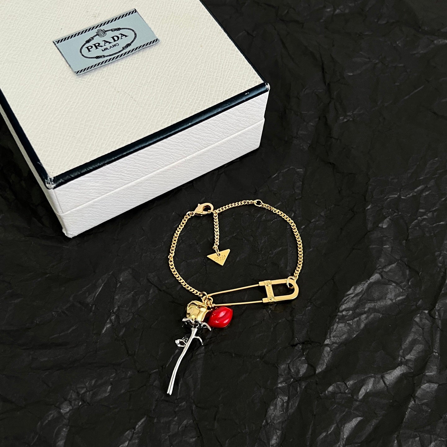 Signature Emblem Bracelet in Polished Metal-Tone detail view