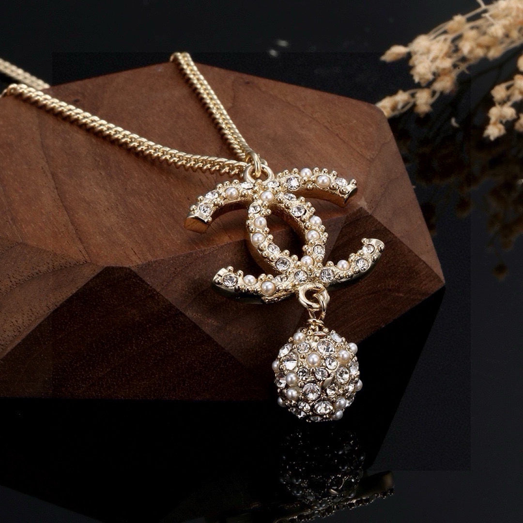 Double-C Emblem Pearl-Detail Pendant Necklace – Pearl Detail – Design 009 styled product view