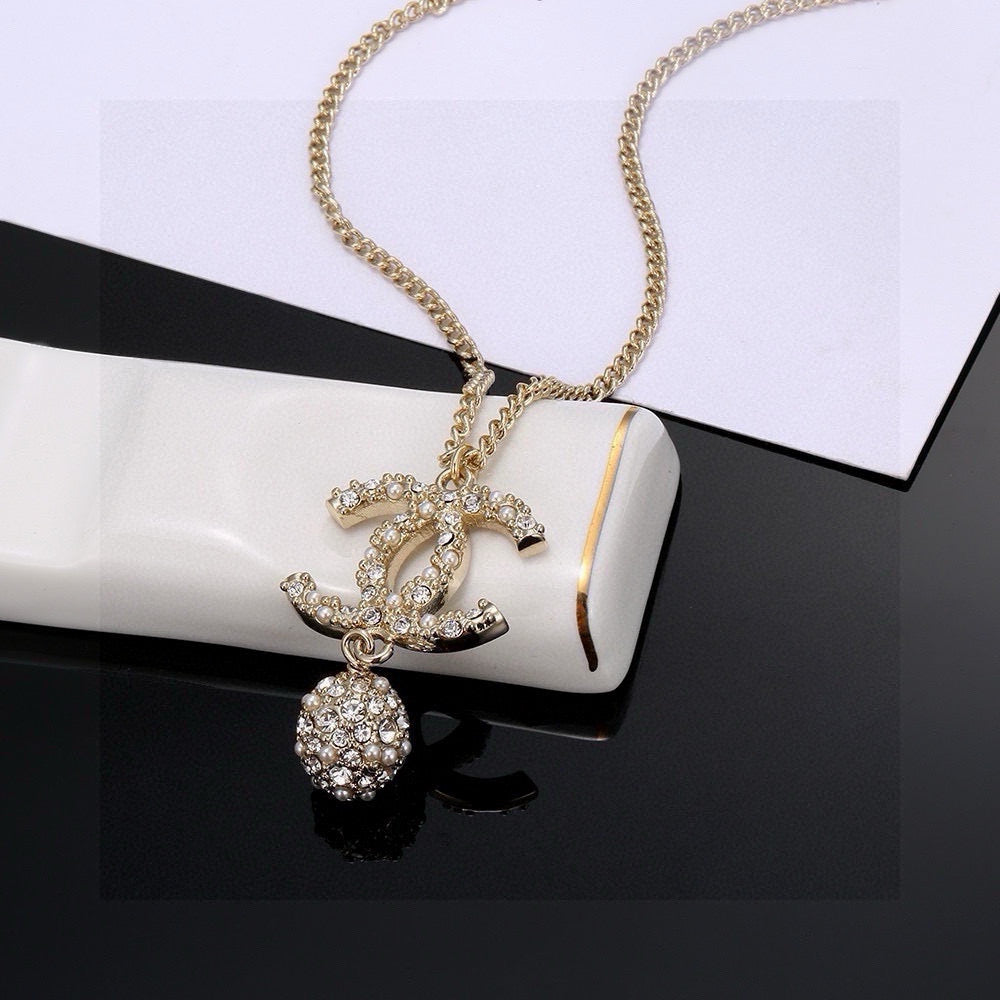 Double-C Emblem Pearl-Detail Pendant Necklace – Pearl Detail – Design 009 close-up detail