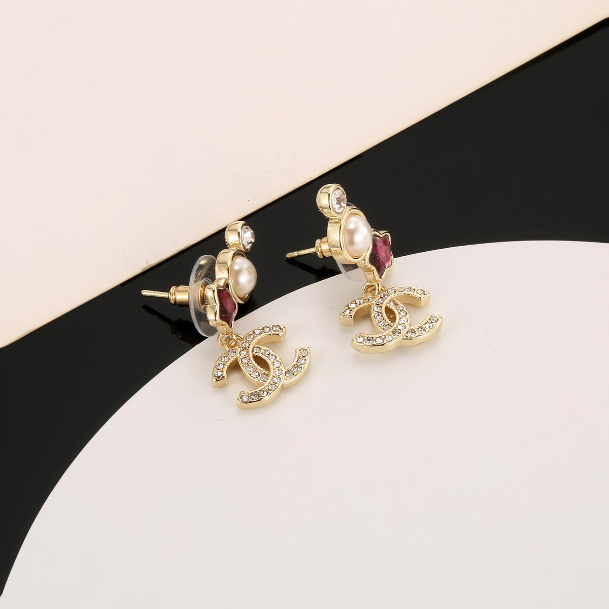 Double-C Emblem Stud Earrings in Gold-Tone – Star Detail – Design 003 close-up detail