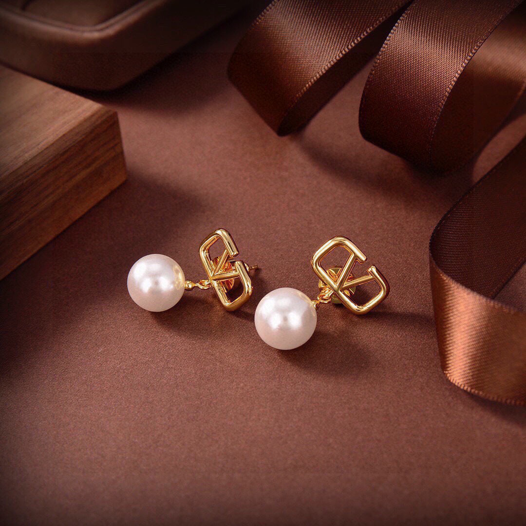 Signature Emblem Stud Earrings in Gold-Tone – Design 20 close-up view