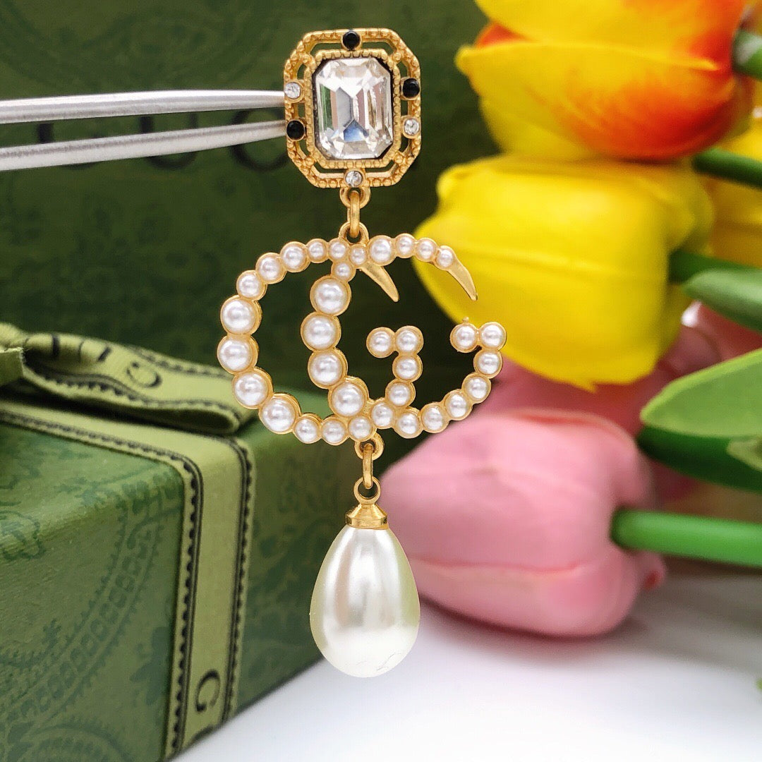Geometric Emblem Stud Earrings in Polished Metal-Tone – Crystal Detail main product view