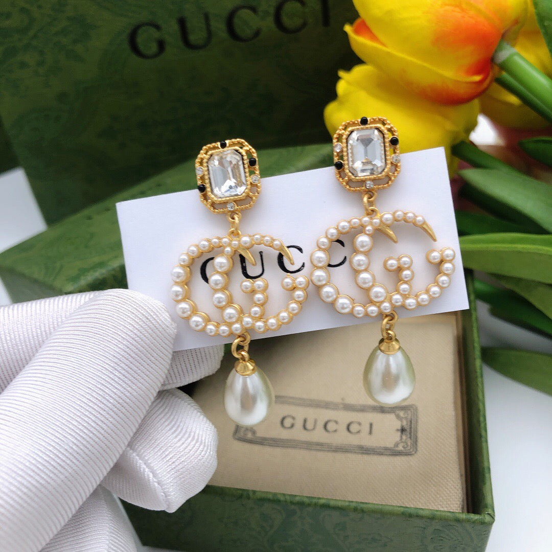 Geometric Emblem Stud Earrings in Polished Metal-Tone – Crystal Detail front product view