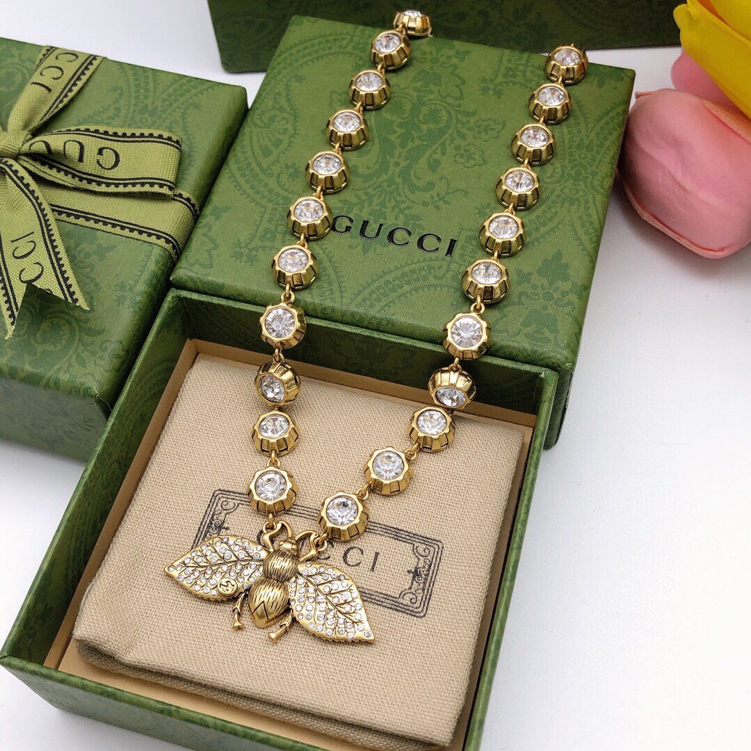 Bee Pendant Necklace in Polished Metal-Tone detail view