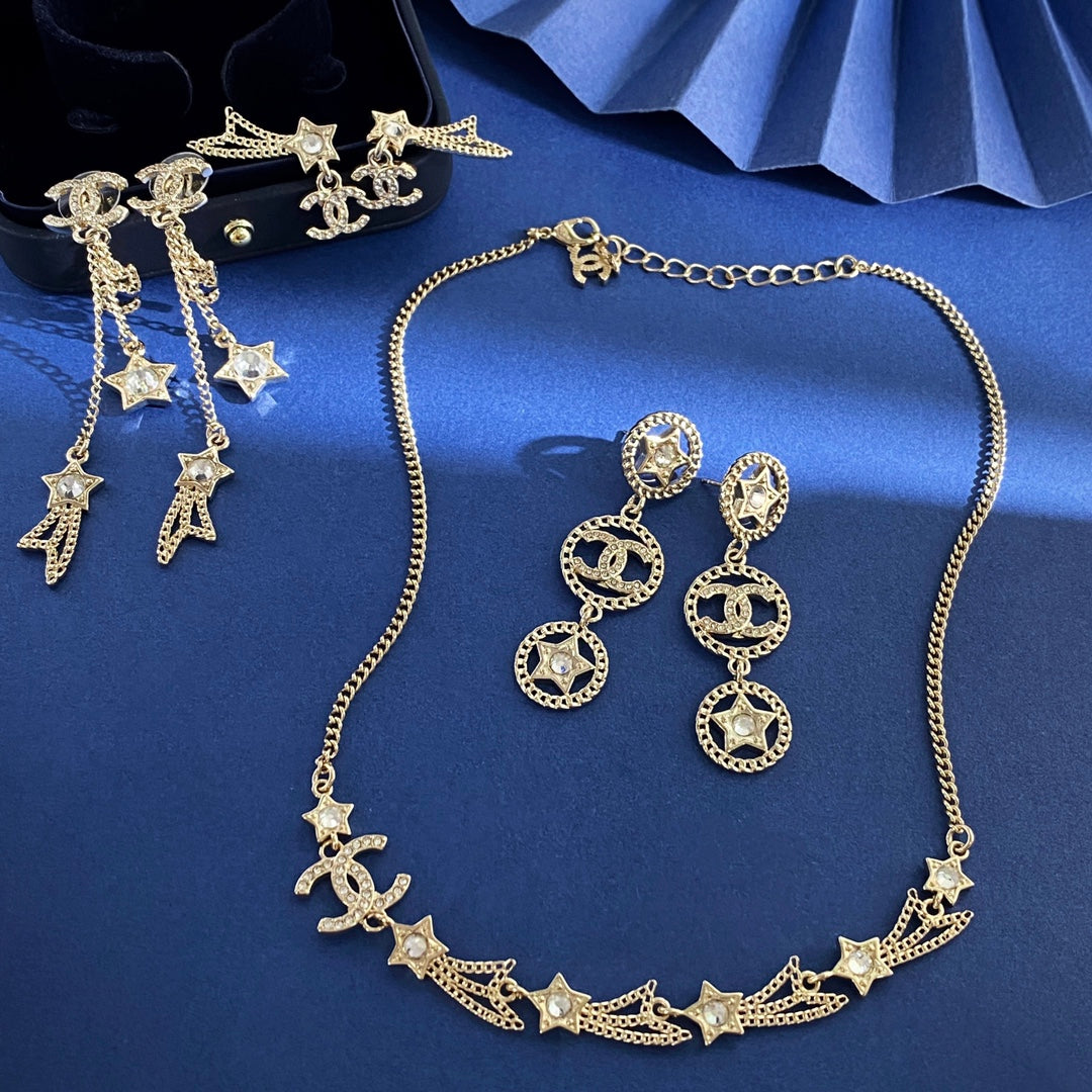 Double-C Emblem Stud Earrings in Gold-Tone – Star Detail – Design 009 detail view