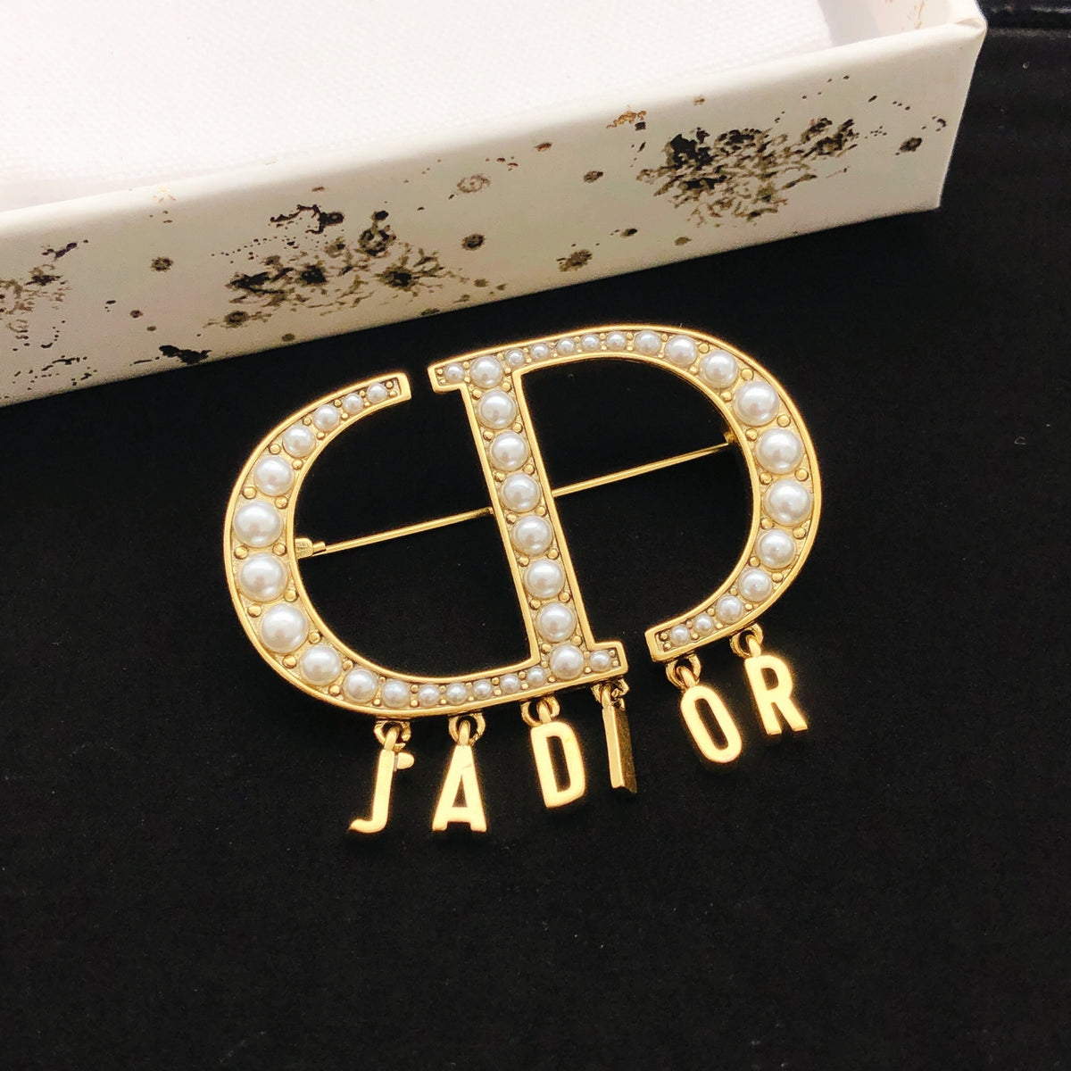 Graphic Letter Motif Brooch Pin in Polished Metal-Tone – Design 010 front view
