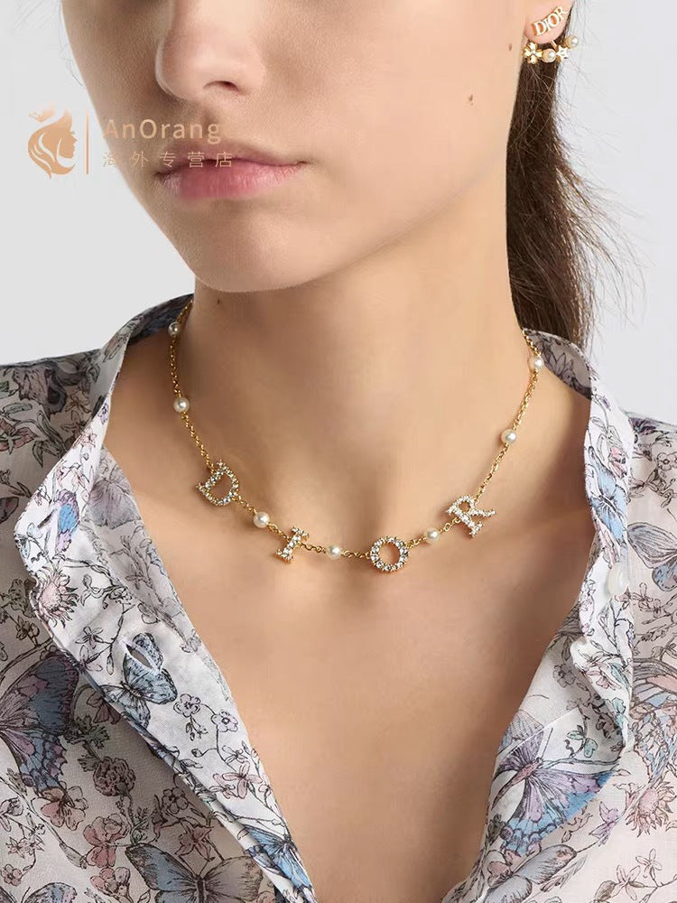 Graphic Letter Motif Pendant Necklace in Polished Metal-Tone – Design 025 front view