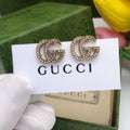 Double-G Emblem Stud Earrings in Polished Metal-Tone – Design 021 main product view