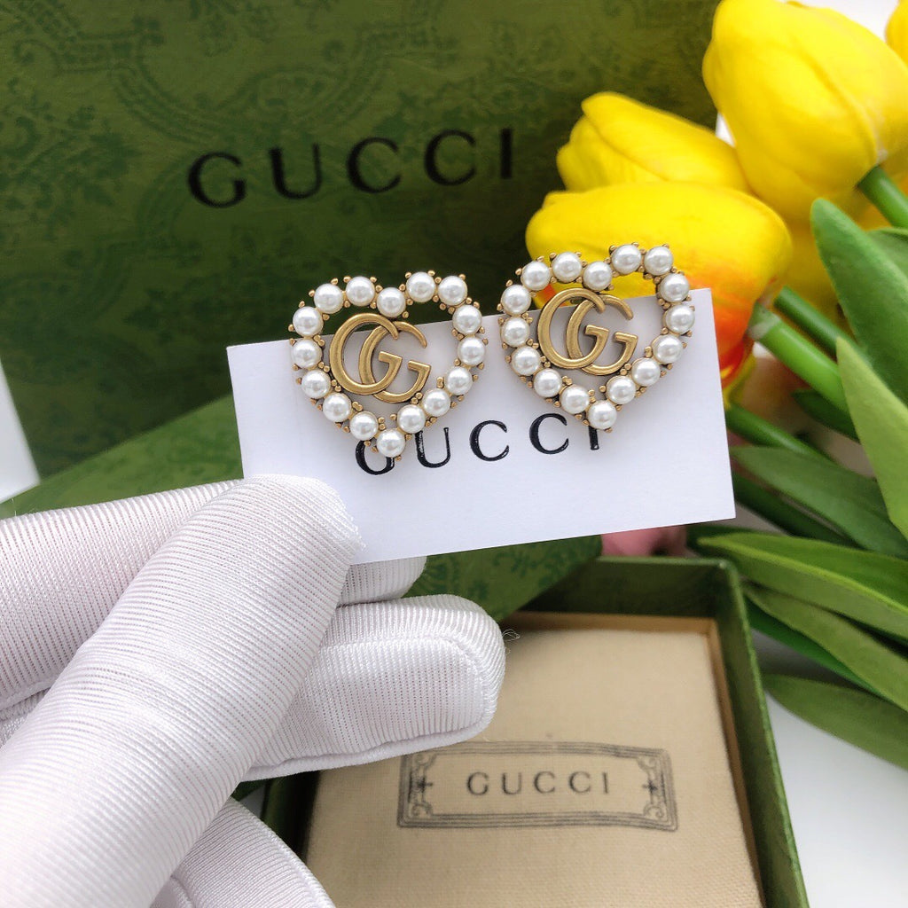 Double-G Emblem Stud Earrings in Polished Metal-Tone – Design 019 detail view