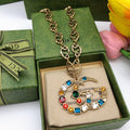 Double-G Emblem Pendant Necklace in Polished Metal-Tone – Crystal Detail – Design 003 main product view