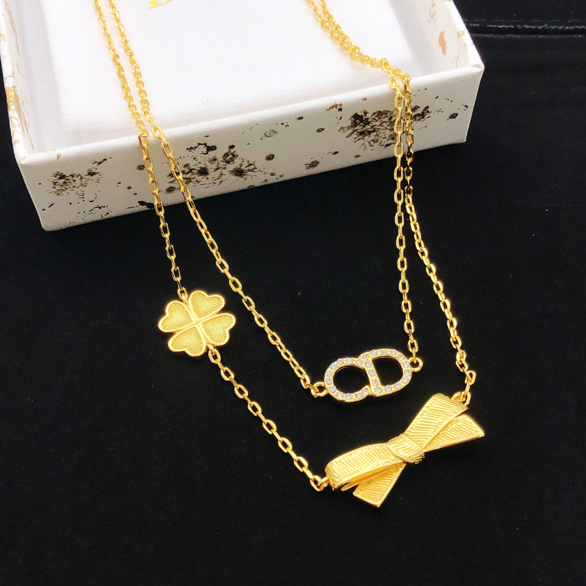 Bow & Butterfly Motif Pendant Necklace in Polished Metal-Tone with Layered Detail – Design 004 main product view