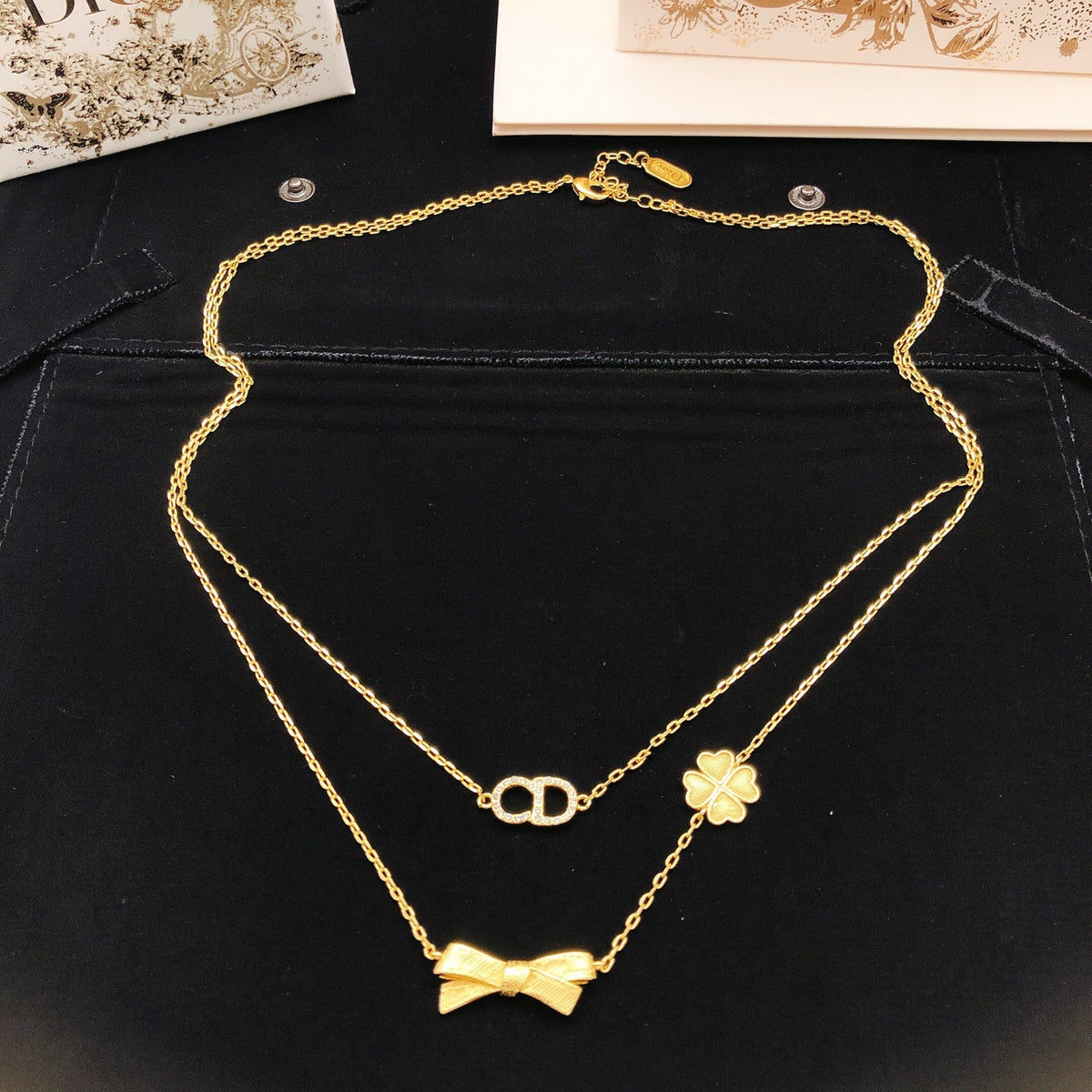 Bow & Butterfly Motif Pendant Necklace in Polished Metal-Tone with Layered Detail – Design 004 close-up detail