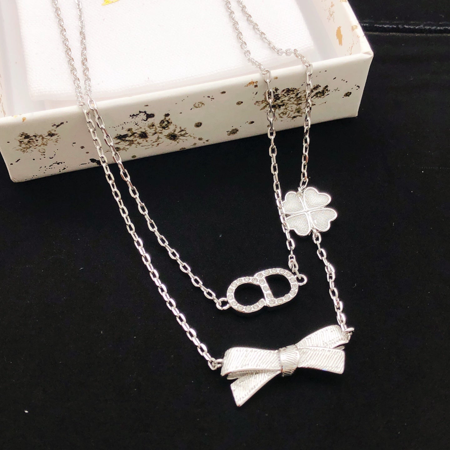 Bow & Butterfly Motif Pendant Necklace in Polished Metal-Tone with Layered Detail – Design 003 main product view