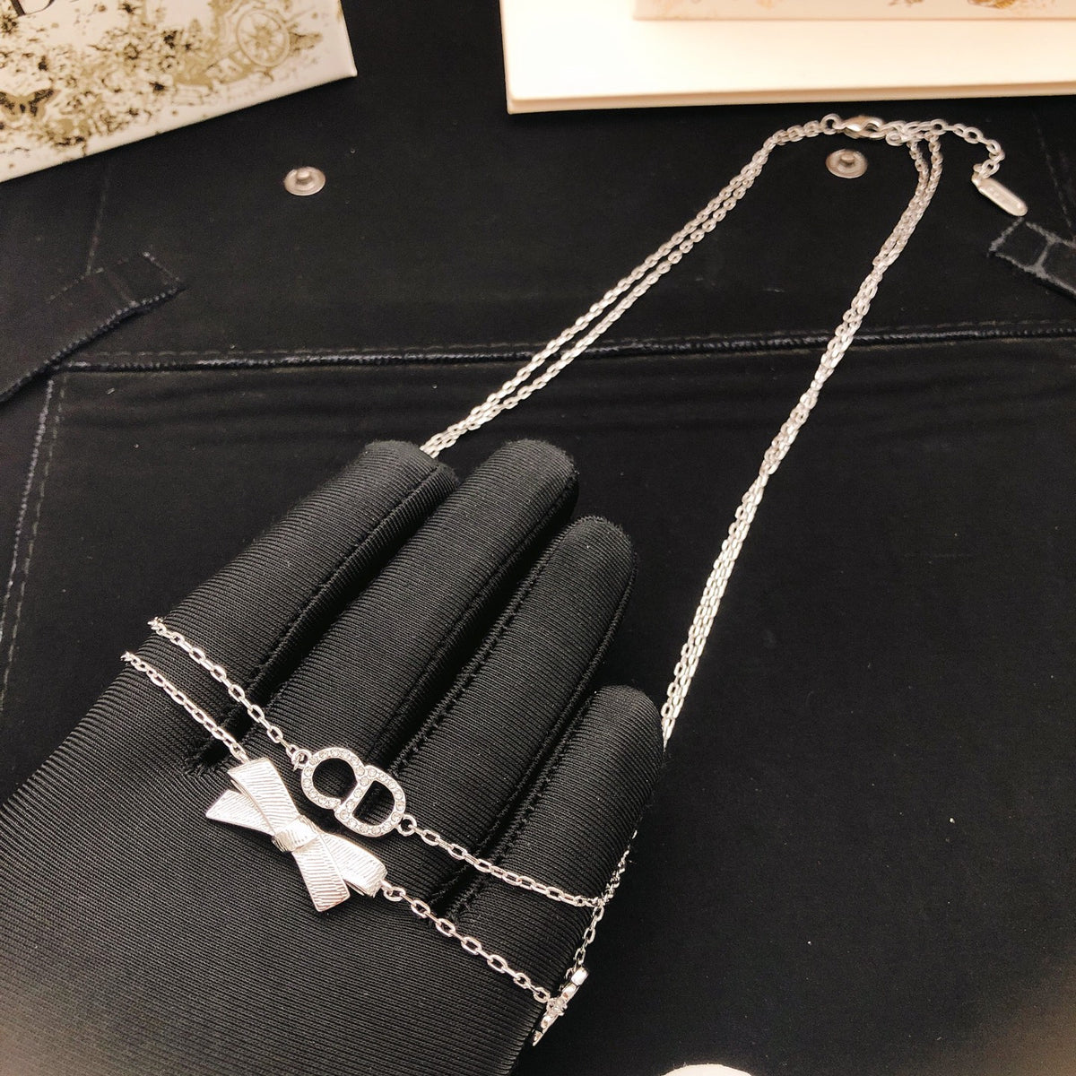 Bow & Butterfly Motif Pendant Necklace in Polished Metal-Tone with Layered Detail – Design 003 styled view