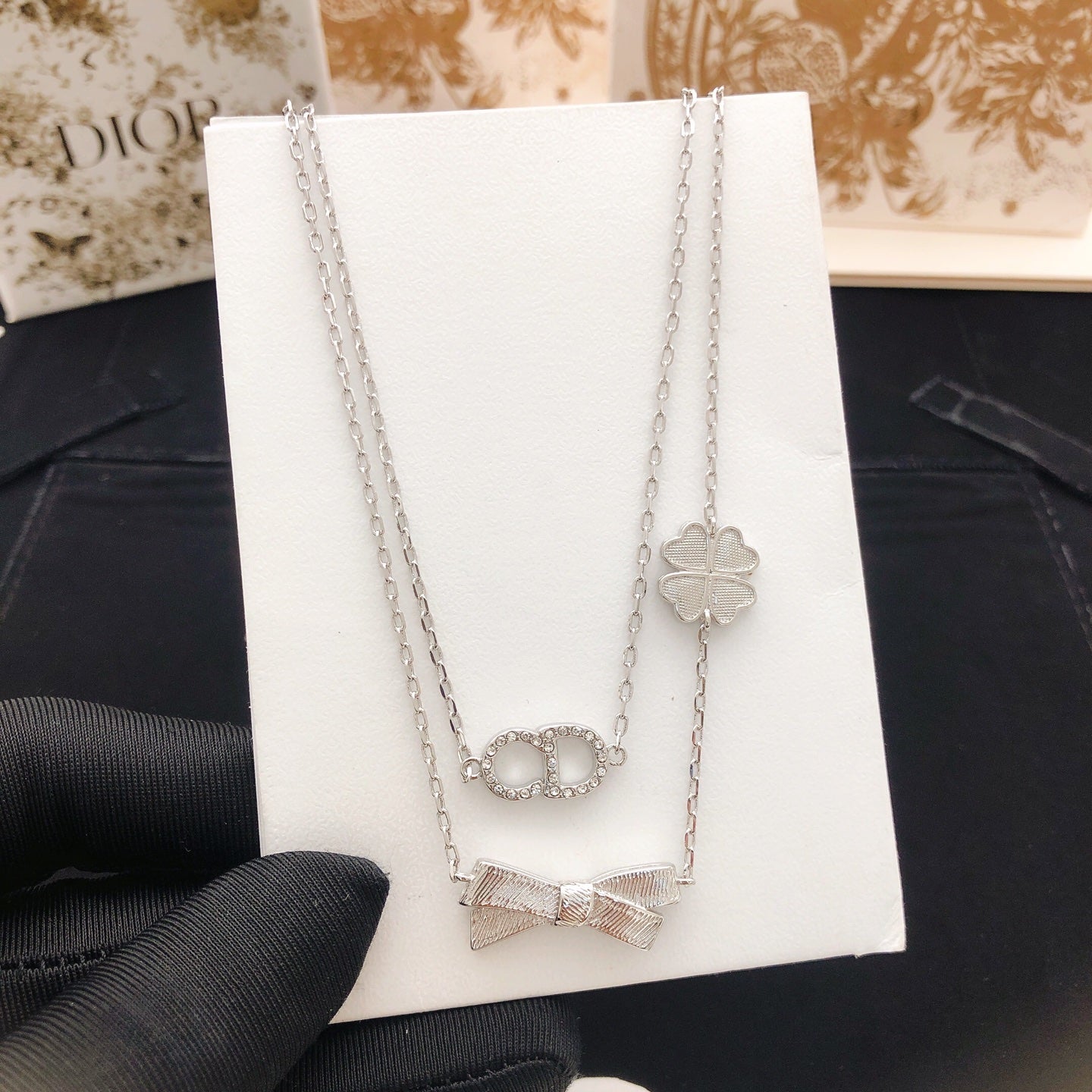 Bow & Butterfly Motif Pendant Necklace in Polished Metal-Tone with Layered Detail – Design 003 close-up detail