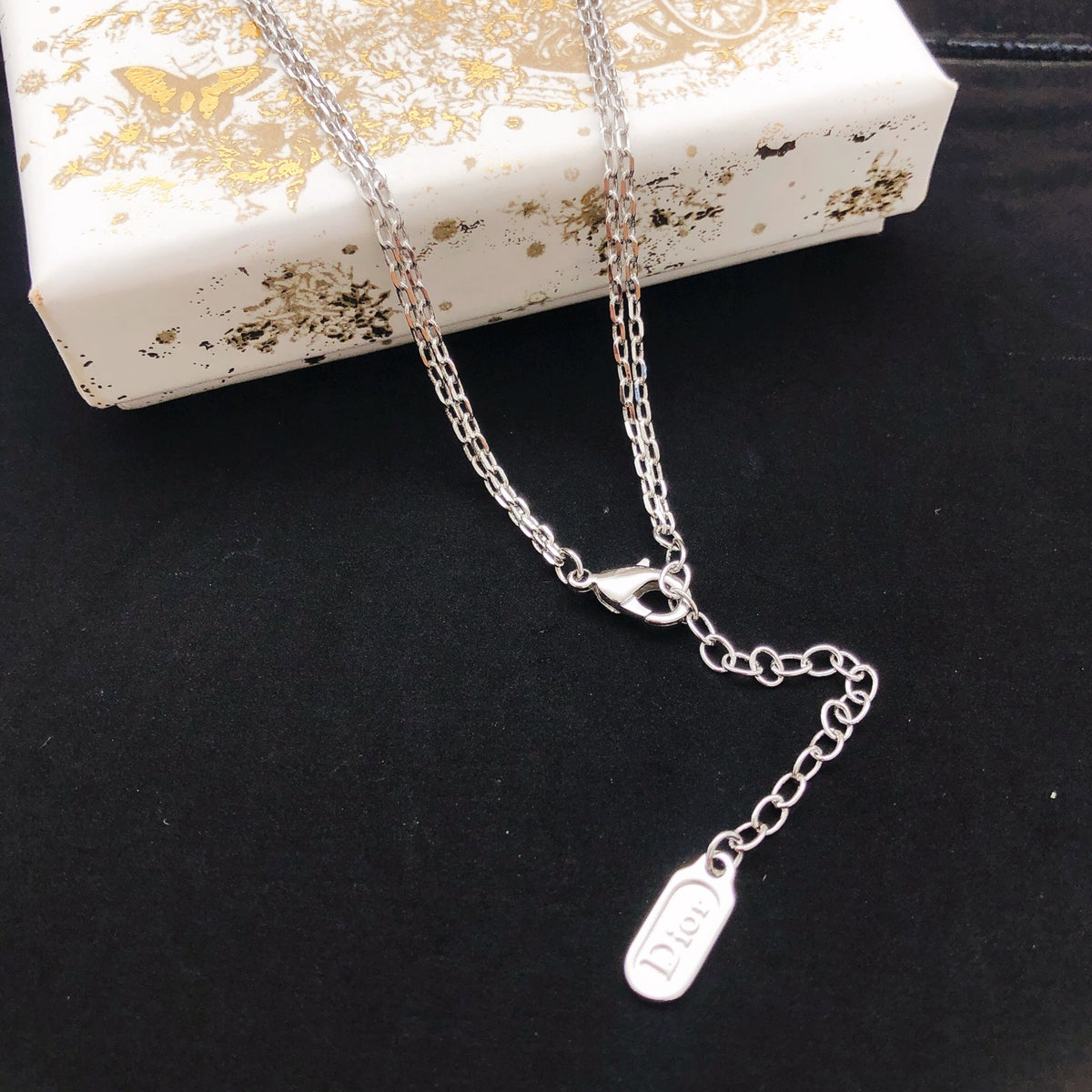 Bow & Butterfly Motif Pendant Necklace in Polished Metal-Tone with Layered Detail – Design 003 detail view