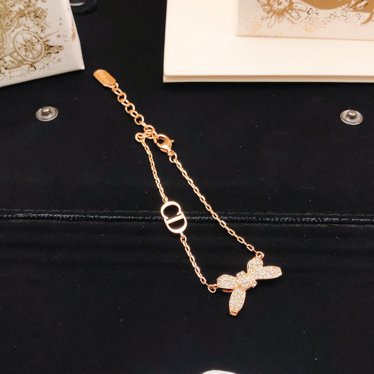 Bow & Butterfly Motif Statement Bracelet in Rose-Gold-Tone front view