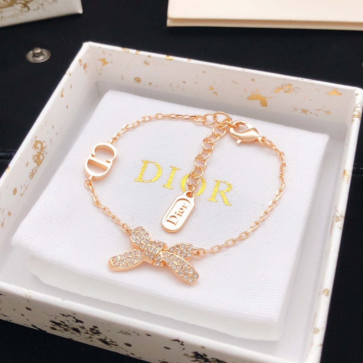Bow & Butterfly Motif Statement Bracelet in Rose-Gold-Tone detail view