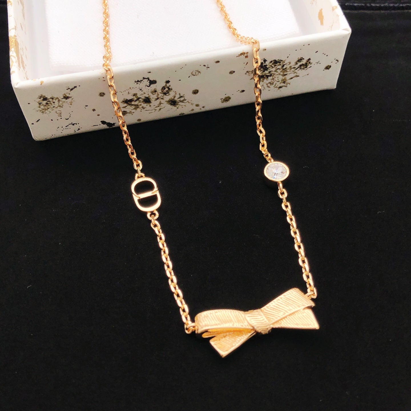 Bow & Butterfly Motif Pendant Necklace in Rose-Gold-Tone main product view