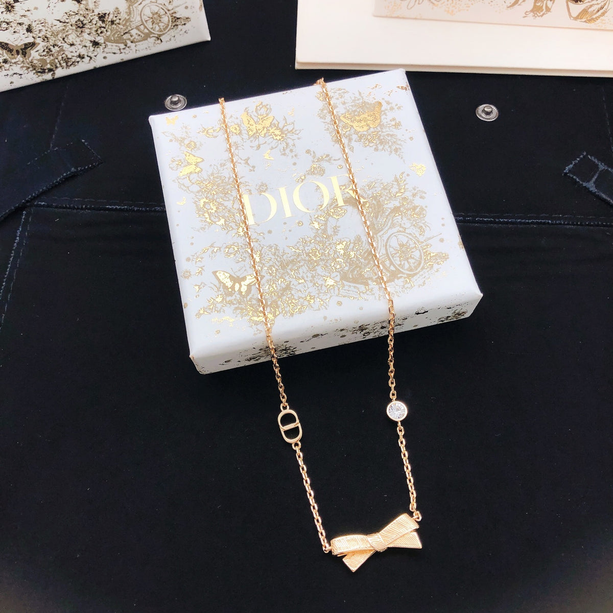 Bow & Butterfly Motif Pendant Necklace in Rose-Gold-Tone front view