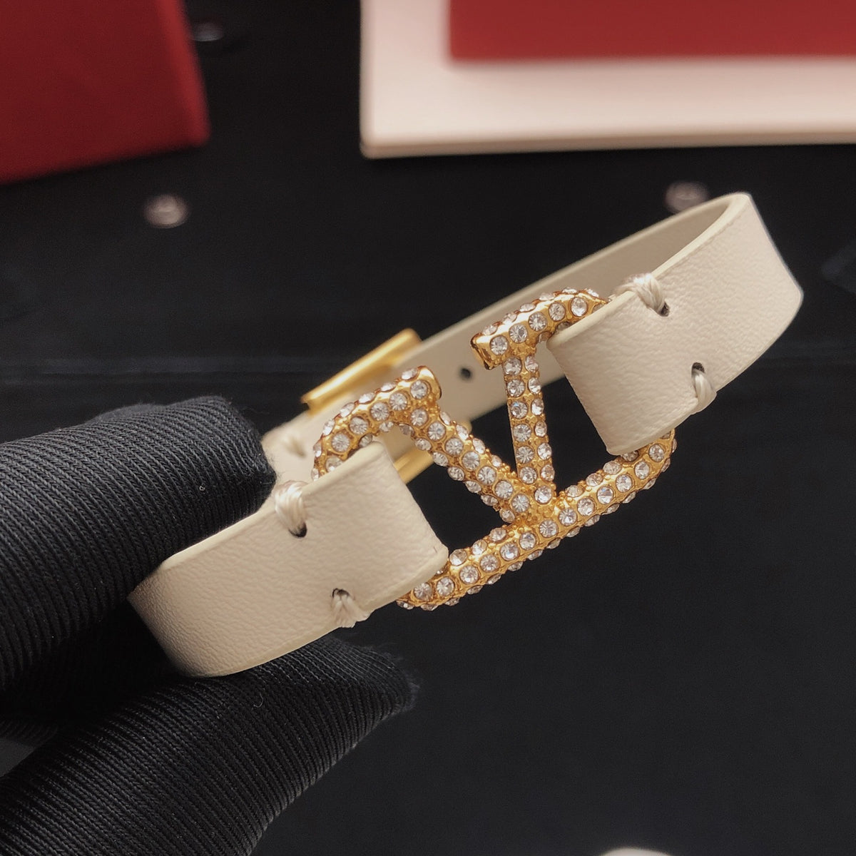 Signature Emblem Bracelet in Gold-Tone – White front view