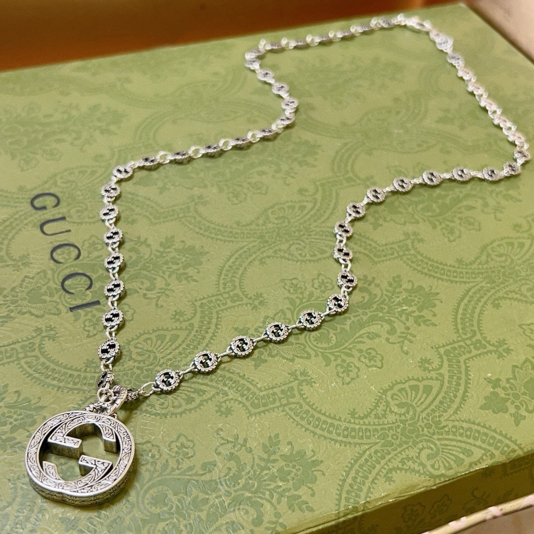 Double-G Emblem Pendant Necklace in Polished Metal-Tone – Vintage Detail – Design 056 close-up detail