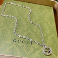 Double-G Emblem Pendant Necklace in Polished Metal-Tone – Vintage Detail – Design 059 main product view