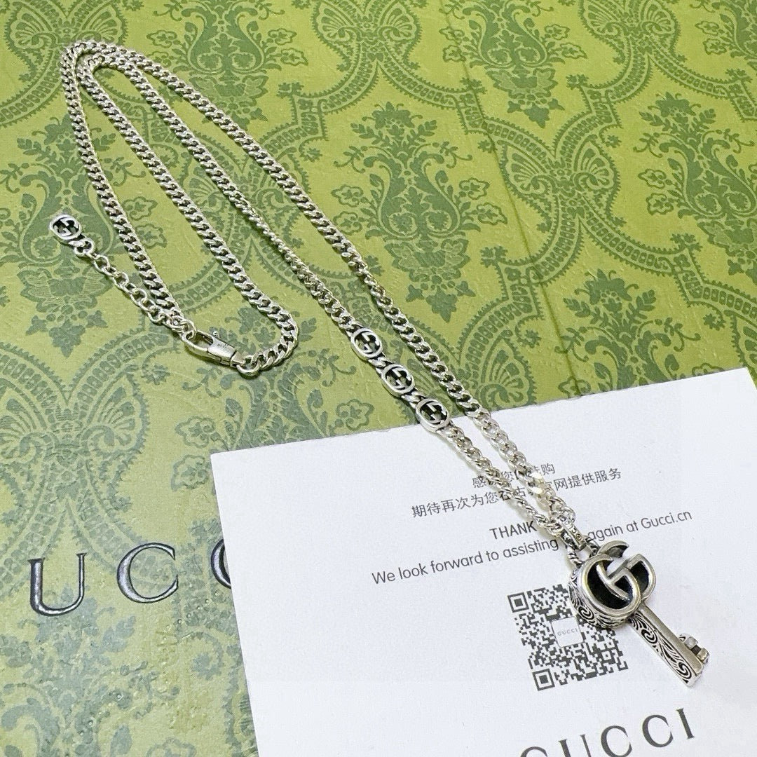 Double-G Emblem Pendant Necklace in Polished Metal-Tone – Vintage Detail – Design 058 side detail