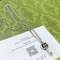Double-G Emblem Pendant Necklace in Polished Metal-Tone – Vintage Detail – Design 022 main product view