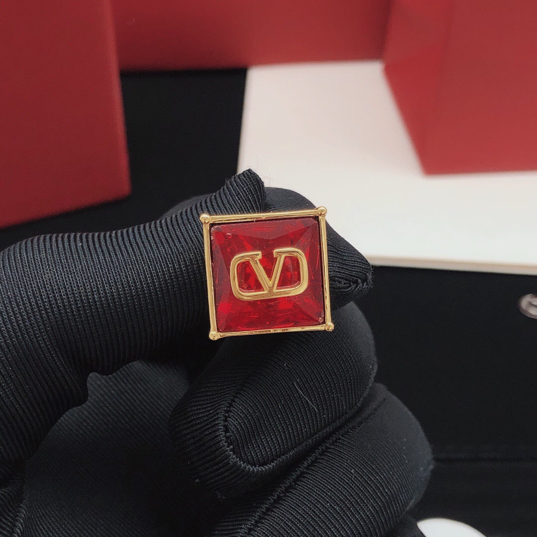 Signature Emblem Stud Earrings in Polished Metal-Tone – Red – Design 02 close-up view