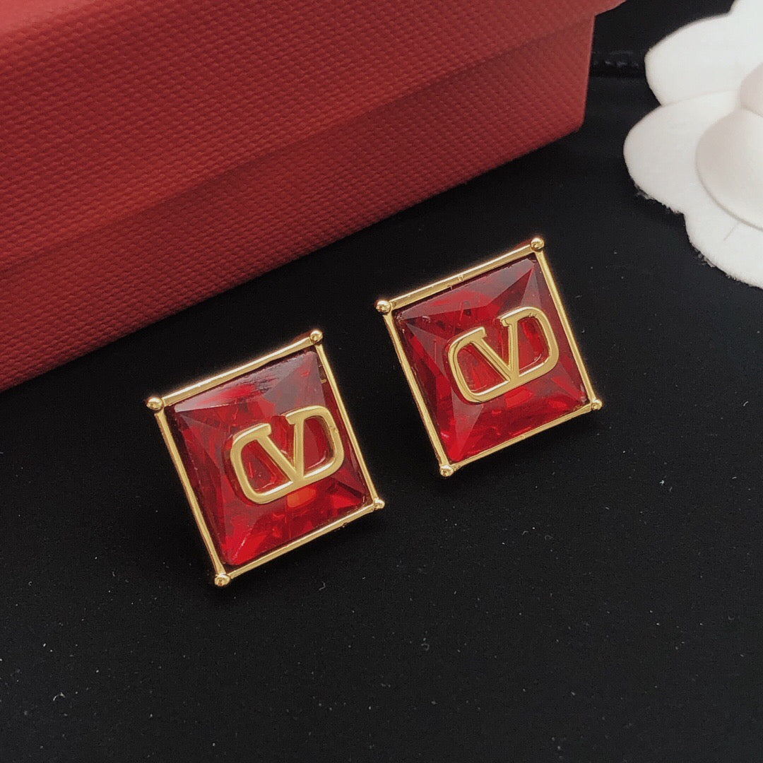 Signature Emblem Stud Earrings in Polished Metal-Tone – Red – Design 02 detail view