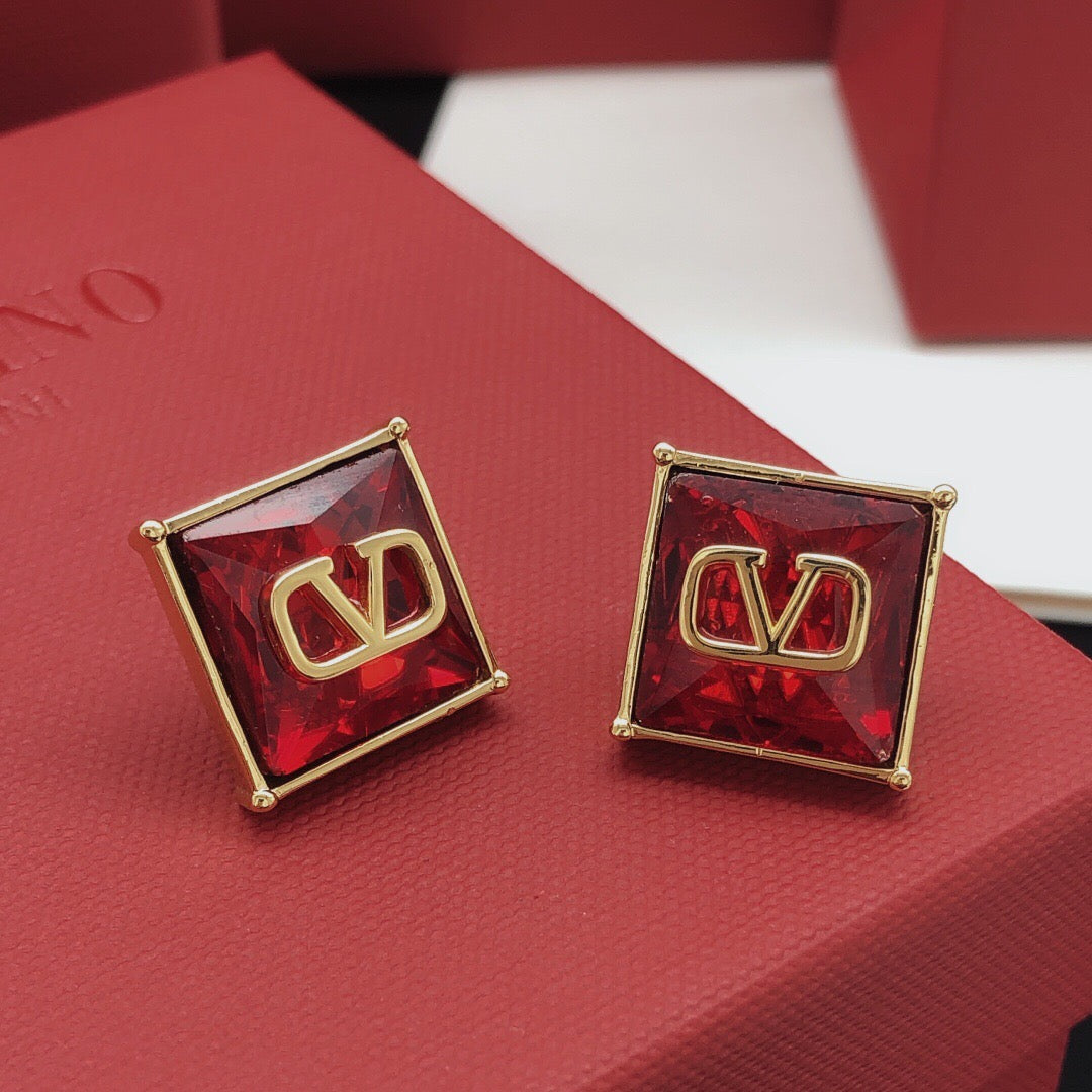 Signature Emblem Stud Earrings in Polished Metal-Tone – Red – Design 02 styled detail